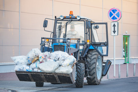 Korolev, Russia - August 08, 2020: Process of the garbage bags moving from the supermarket.のeditorial素材