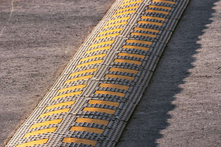 Traffic safety speed bump on the asphalt road.の写真素材