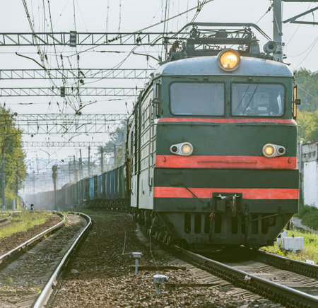 Long freight train moves on the station.の写真素材