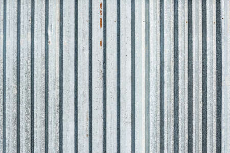 Old gray metallic vertical material wall background.の写真素材