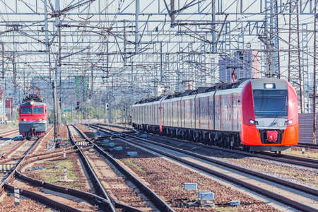 Highspeed train and locomotive on the station.の写真素材
