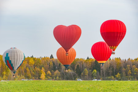 Morning flight of the hot air balloons above the countryside.の写真素材