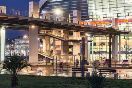 Sochi, Russia - October 19, 2020: Exterior of the Adler railway station at evening time after rain.のeditorial素材