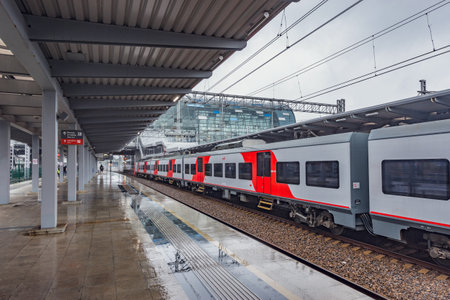 Sochi, Russia - October 19, 2020: Passenger platforms of Adler railway station at rainy evening time.のeditorial素材
