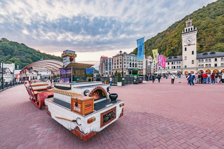 Roza Khutor, Russia - October 18, 2020: Central square of the touristic resort at autumn sunset time.のeditorial素材