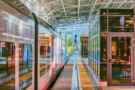 Roza Khutor station, Russia - October 15, 2020: Passenger train to Sochi stands by the platform before departure.のeditorial素材