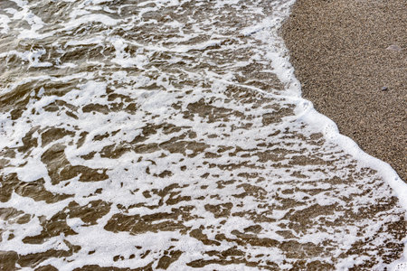 Wave of the sea water at evening time.の写真素材