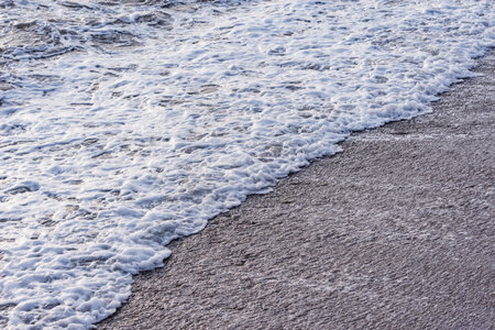 Wave of the sea water at evening time.の写真素材