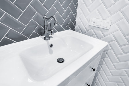 Close uo image of the white sink in the bathroom.の写真素材