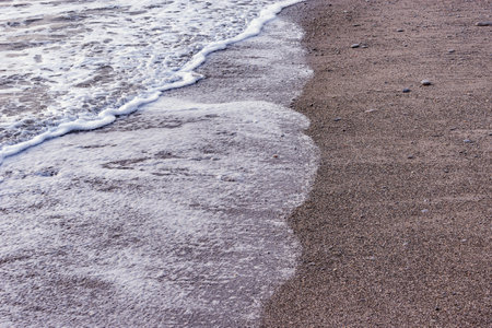 Wave of the sea water at evening time.の写真素材