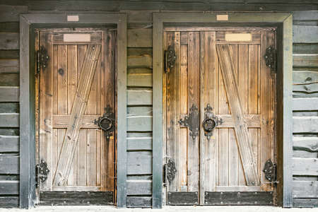 Doors of the old wooden private house.の写真素材