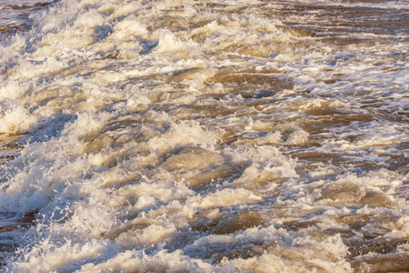 Wave of the sea water at sunset time.の写真素材
