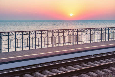 Passenger platform by Black sea coast at sunset. Sochi. Russia.の写真素材