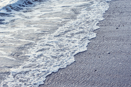 Wave of the sea water at evening time.の写真素材