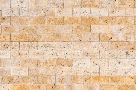 Yellow clean stone wall of the building.の写真素材