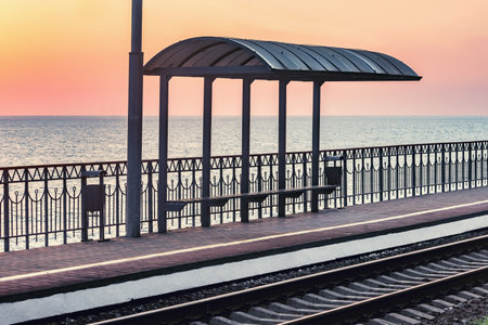 Passenger platform by Black sea coast at sunset. Sochi. Russia.
