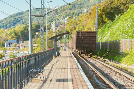 Freight train moves along the platform by Black sea coast. Sochi. Russia.の写真素材
