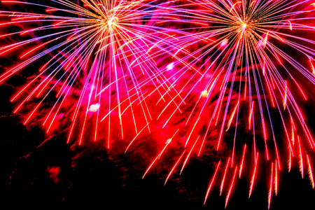 Fireworks in the night winter sky. New year celebration.の写真素材