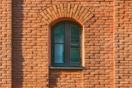 Closed window in the old brick building.の写真素材