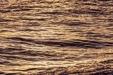 Water surface of the open sea at sunset. Black sea.の写真素材