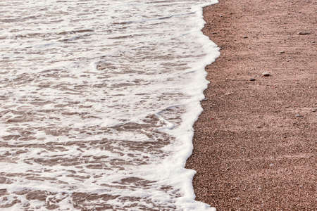 Wave of the sea water at evening time.の写真素材