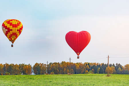 Morning flight of the hot air balloons above the countryside.の写真素材