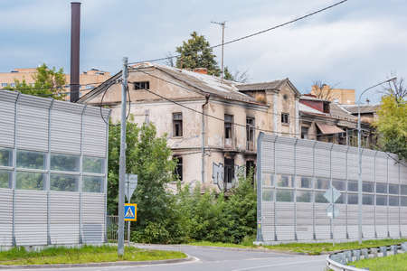 Burnt and destroyed house by the highway at evening time.の写真素材