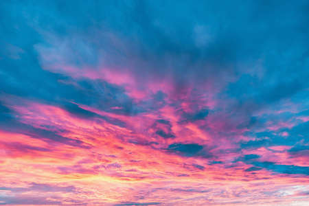 Amazing colorful clouds on the evening sunset sky.の写真素材