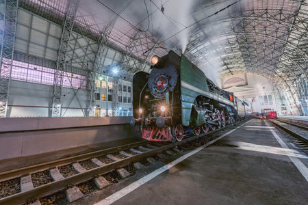 Moscow, Russia - January 30, 2021: Retro steam train stands by the passenger platform.のeditorial素材