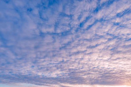 Amazing colorful clouds on the evening sunset sky.