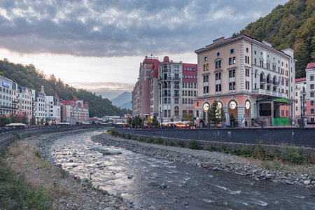 Roza Khutor station, Russia. - October 18, 2020: Sunset view of the street along Mzymta river.のeditorial素材