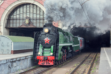 Moscow, Russia - May 25, 2019: Steam retro train departs from the Kazan railway station.のeditorial素材