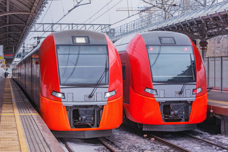 Highspeed trains stand by the station platform at winter day.の写真素材