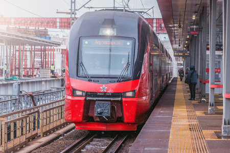 Moscow, Russia - March 04, 2021: Express train from Sheremetyevo airport approaches to the station platform at winter day.のeditorial素材