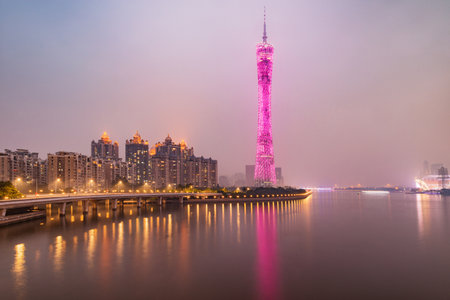 Guangzhou, China - December 21, 2016: Evening view of Canton Tower by Pearl river. Tower is a 604-meter (1,982 ft) -tall multipurpose observation tower in the Haizhu District of Guangzhou,のeditorial素材