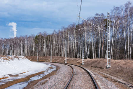 Electrified railway line at winter day time.の写真素材