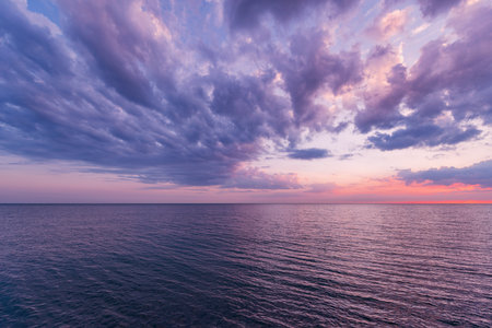 Sunset view of the sea coast at summer time.の写真素材