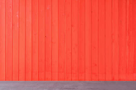 Wooden table by the red wooden timber wall.