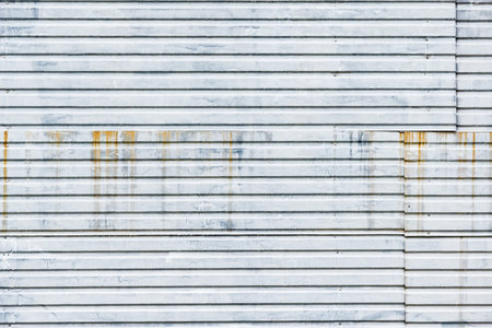 Gray metallic material stylized wall background.の写真素材