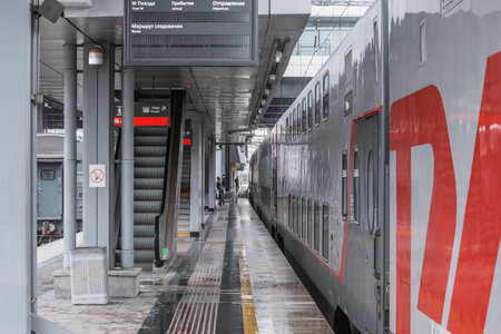 Sochi, Russia - April 10, 2021: Passenger train stands by the Adler station platform.のeditorial素材