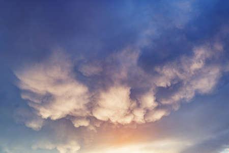 Amazing cloudscape on the sky at sunset time after rainの写真素材