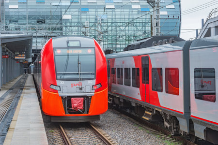 Sochi, Russia - April 10, 2021: Passenger train arrives to the Adler station platform.のeditorial素材