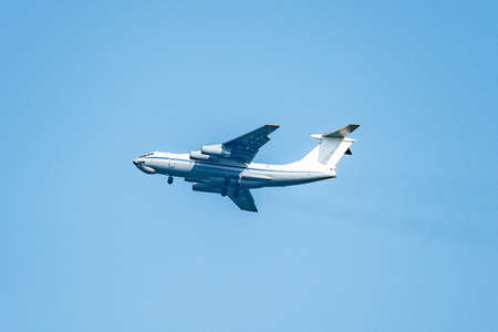 Flight of the big cargo airliner at day time.の写真素材