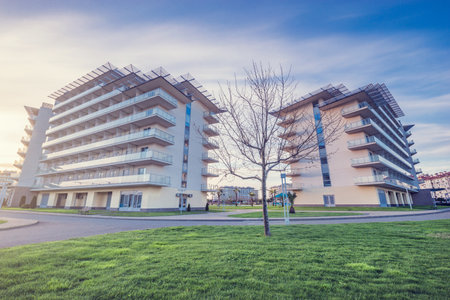 New apartment house buildings at sunset time.の写真素材