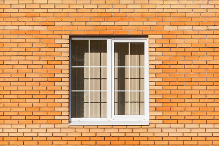 Window and red brick wall of the new house.の写真素材