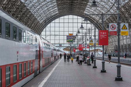 Moscow, Russia - May 30, 2021: Passengers on the platform by the train before boarding.のeditorial素材