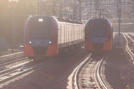 Electric trains move at sunset time. Moscow. Russia.