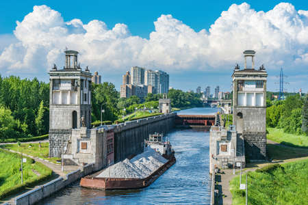 Freight ship moves through the gateway of the river. Moscow. Russia.の写真素材