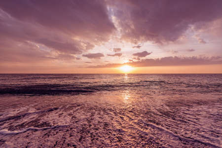 Sunset view of the sea coast at summer time.の写真素材