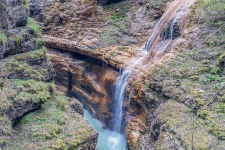 Kurdzhips river and waterfall in the deep narrow Guam canyon. Western Caucasus. Russia.の写真素材